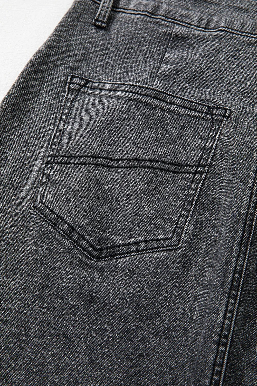 Close-up of pocket detail on the Zuri Maxi Denim Skirt in Black.