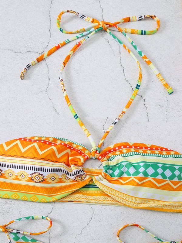 Laid flat yellow-orange bikini set with patterned details and tie sides.