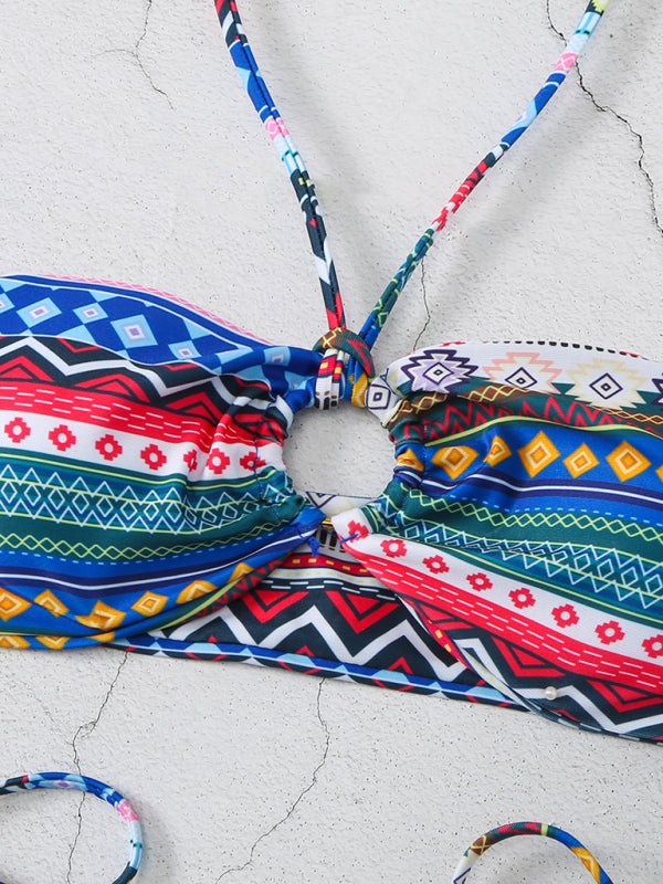 Flat lay of blue-red Adria bikini showing bandeau top and cheeky bottom.