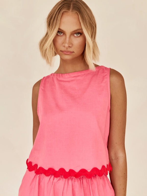Close-up of the Allessa Set's top in vibrant pink with scalloped edge detail.