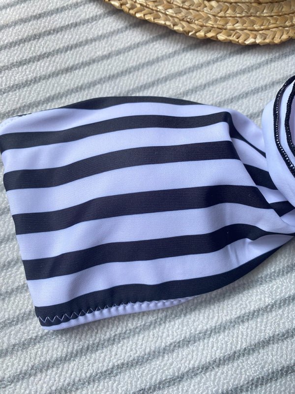 Flat lay of Boob Tube Striped Bikini set with striped top and high-waist bottoms.