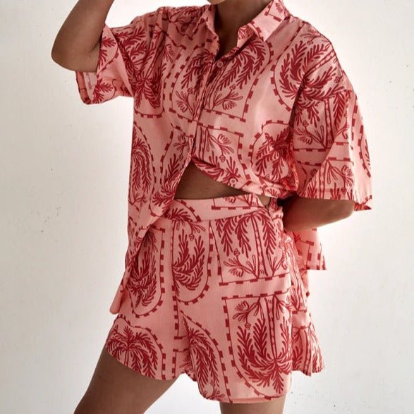 Lifestyle shot of Calico Watermelon Two Piece Set styled casually indoors.