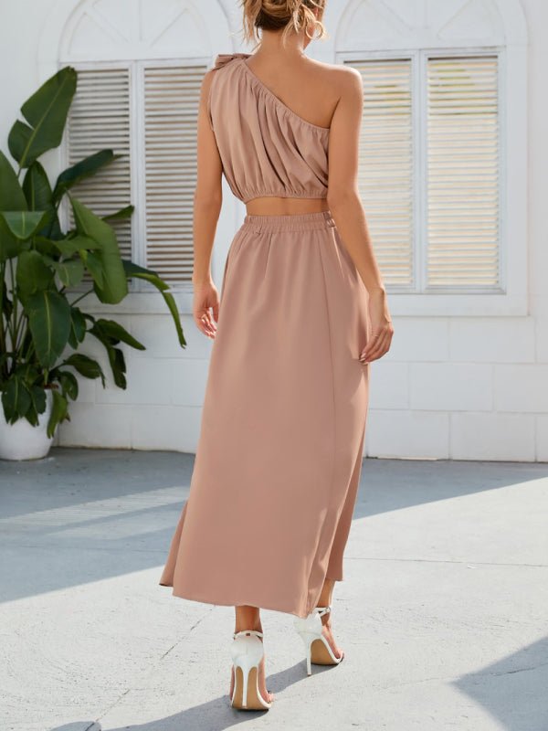 Side angle in nude highlighting ruched top and skirt flow.