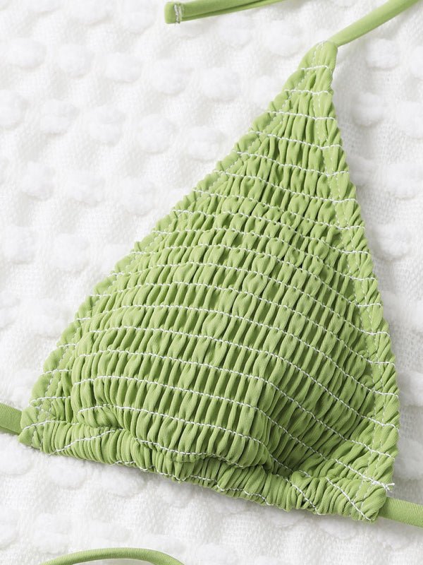 Close-up of the Midori Summer Bikini top in textured green fabric.