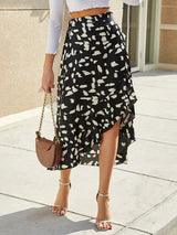 Side view of Asymmetric Polka Dot Midi Skirt showing ruffled hem and flowing asymmetric cut