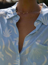 Detail of shirt collar and soft cotton texture in the Suvi two piece set.