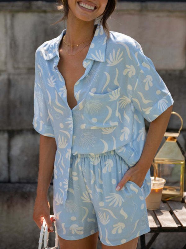 Full-body image of Suvi cotton two piece set showing button-up shirt and high-waisted shorts.