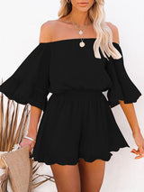 Adelaide Chiffon Playsuit in black, featuring off-the-shoulder design and sheer long sleeves
