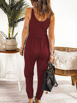 Back view of Caprice Buttoned Jumpsuit in wine red, showing gathered waistband and fit
