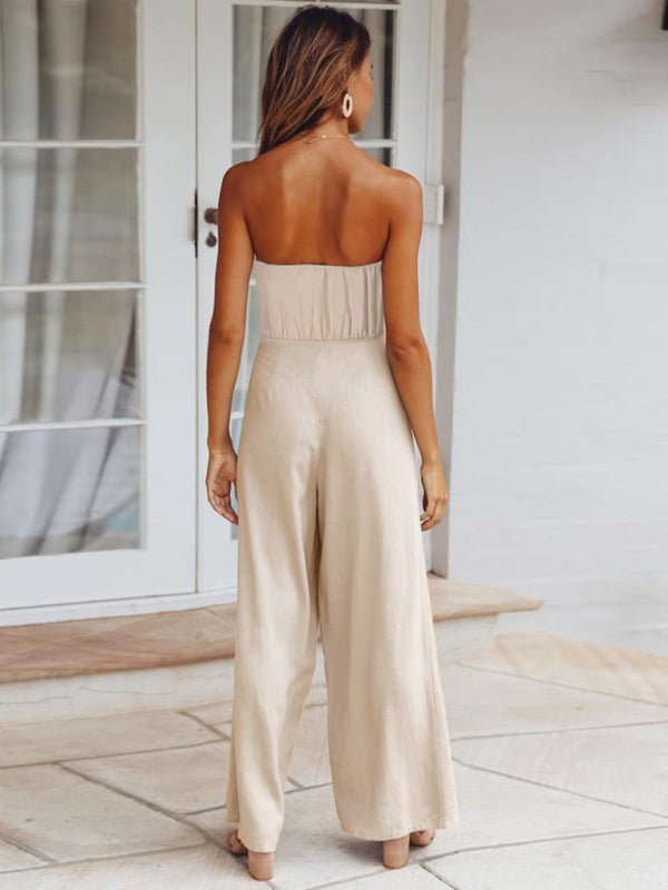 Back view of The Janisa Jumpsuit in khaki, showing the strapless cut and subtle waistline detailing.