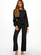 Miss Jane Jumpsuit in Black styled with heels, front view.